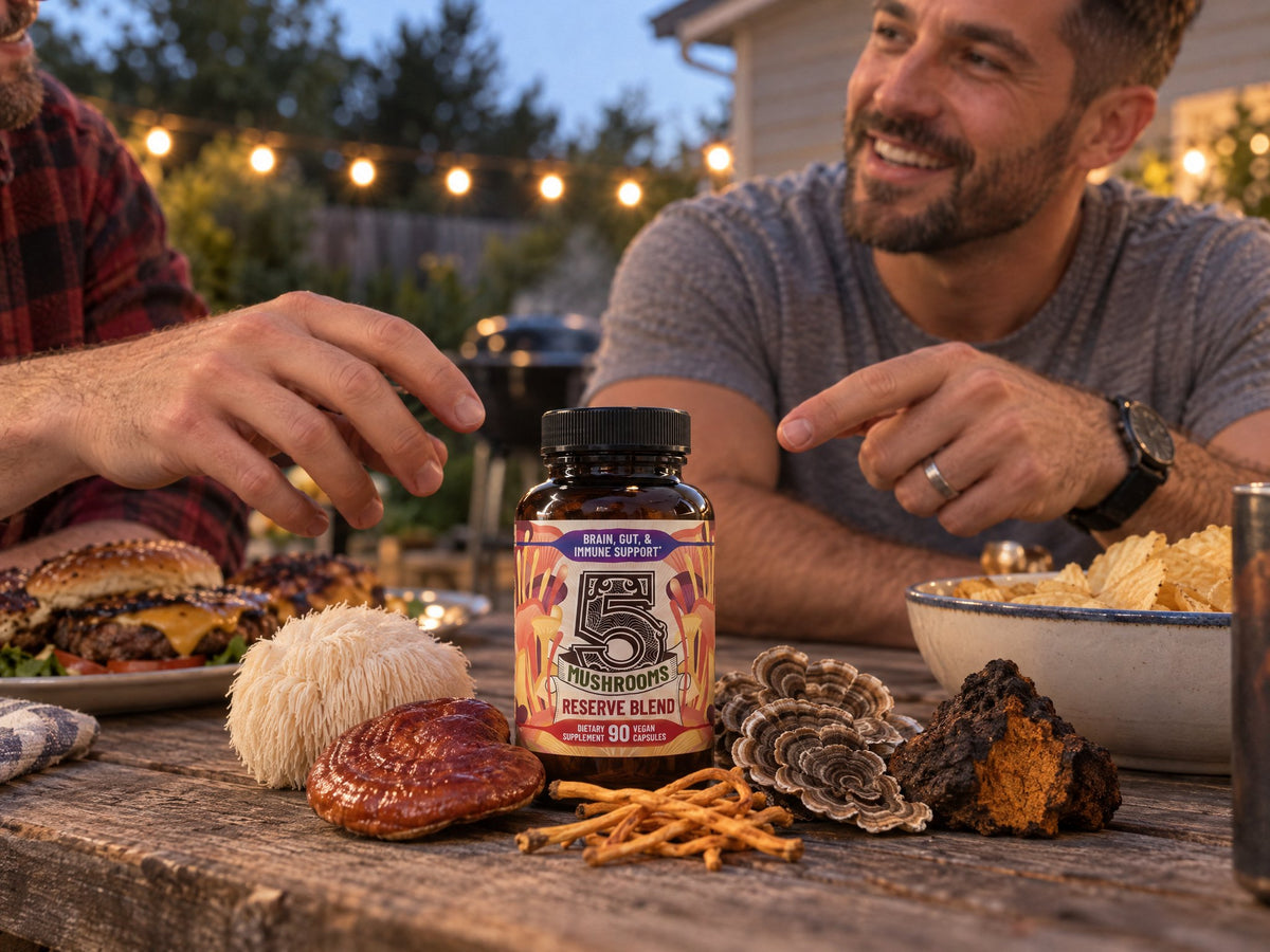 A bottle of 5 Mushrooms Reserve Blend on a picnic table with lion's mane, reishi, turkey tail, chaga and cordyceps