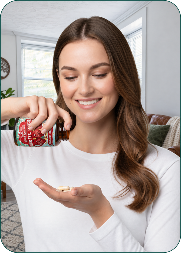 Woman pouring Orchard Tart Cherry capsules into her palm