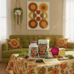 Premium liver cleanse supplement bottle and box on floral table with beet, lemon, and herbs for liver detox and bile support