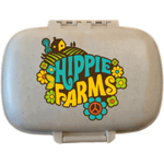 Hippie Farms travel pill case with colorful farm, flower, and peace-sign logo